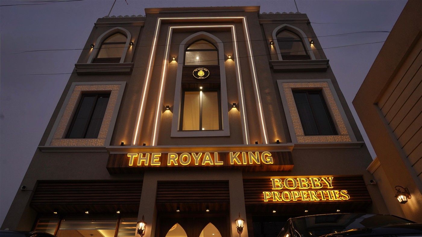 THE ROYAL KING luxury hotel exterior with golden neon signage and elegant architecture in Ludhiana Punjab